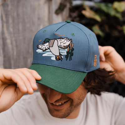 Raised by Coyotes Mallard Snapback Hat